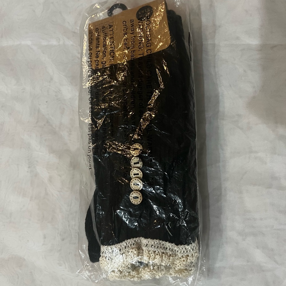 Urban Outfitters,Brand new never opened knee-high black socks, One size